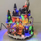 Villaggio di Natale con Luci LED Multicolore e Musica, Paesaggio Natalizio con Movimento, Casa Natalizia Decorativa a Doppia Alimentazione (Elettrica e a Batteria), 24×20.5×29 cm
