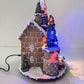 Villaggio di Natale con Luci LED Multicolore e Musica, Paesaggio Natalizio con Movimento, Casa Natalizia Decorativa a Doppia Alimentazione (Elettrica e a Batteria), 24×20.5×29 cm