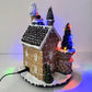 Villaggio di Natale con Luci LED Multicolore e Musica, Paesaggio Natalizio con Movimento, Casa Natalizia Decorativa a Doppia Alimentazione (Elettrica e a Batteria), 24×20.5×29 cm